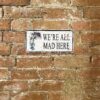 Vintage Metal Sign - Alice In Wonderland - We're All Mad Here